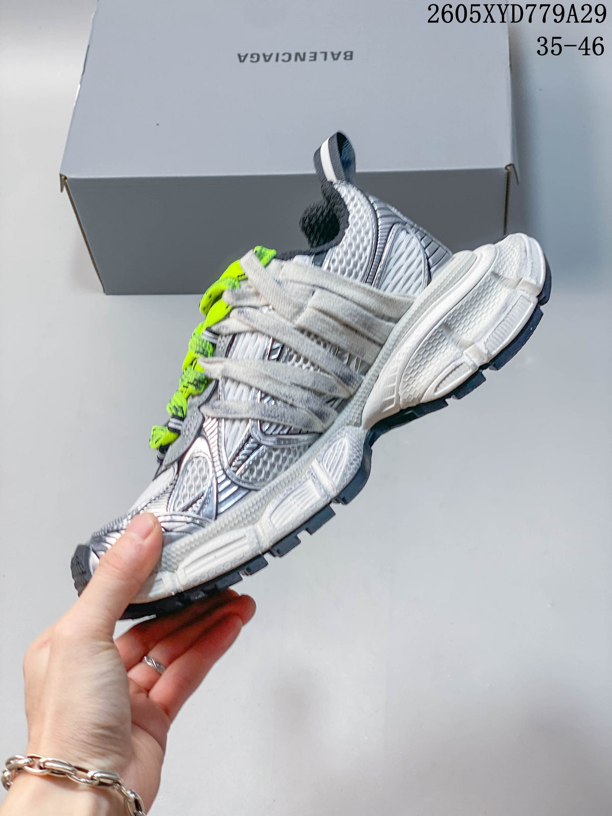 Side view showing the layered panels, chunky sole, and contrasting laces