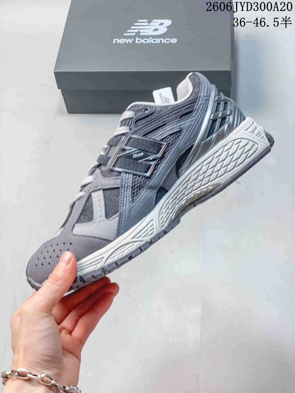 Side view of a grey New Balance 1906 sneaker