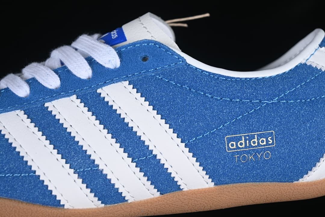 Side detail of the blue upper, white stripes and Tokyo lettering