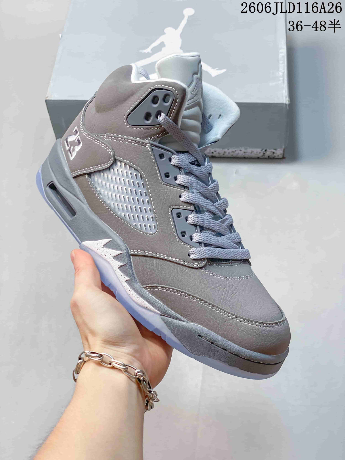 Side view of a gray high-top sneaker with pale accents