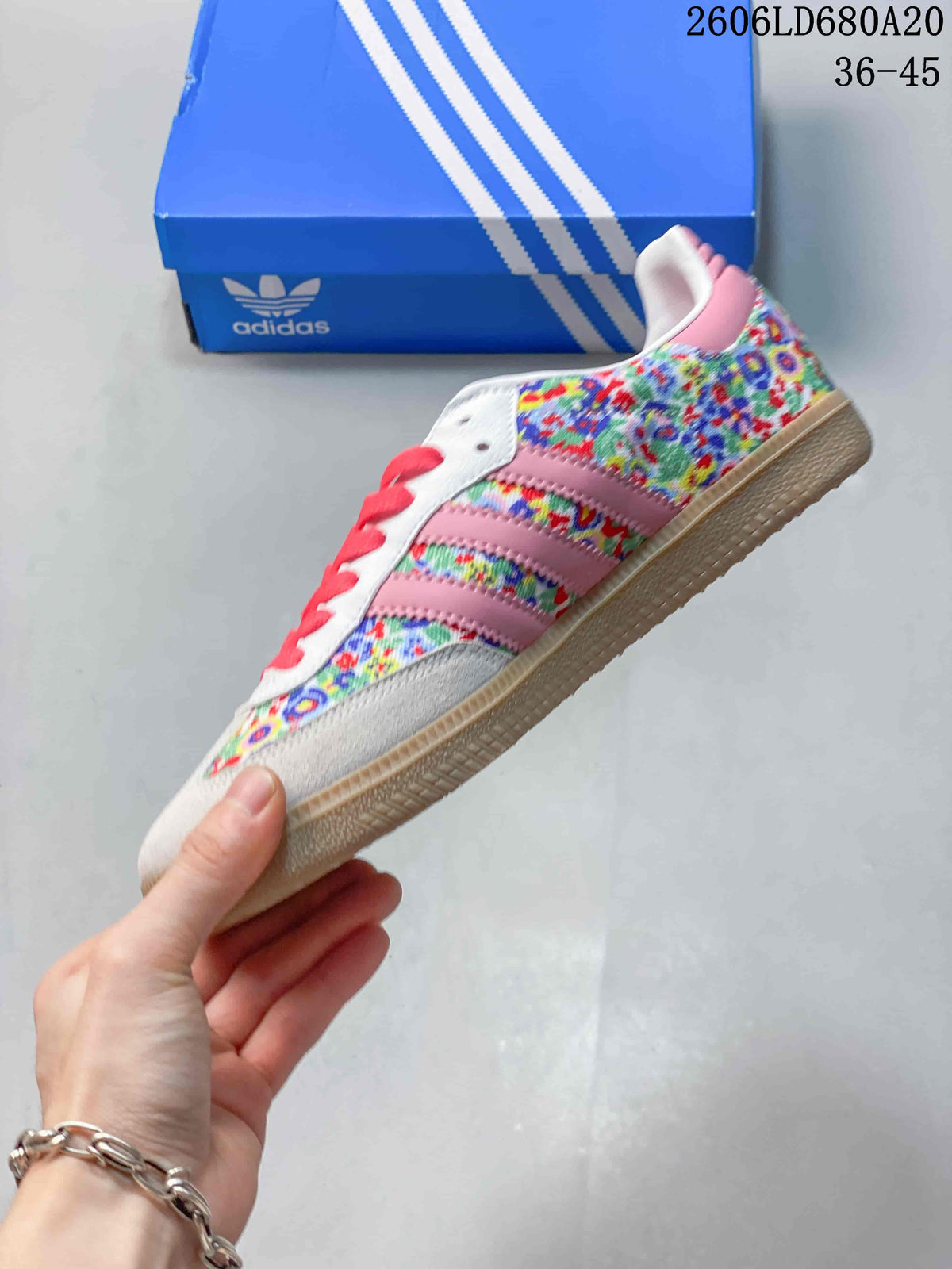 Side view of the floral-patterned sneaker with pink stripes and gum-colored outsole