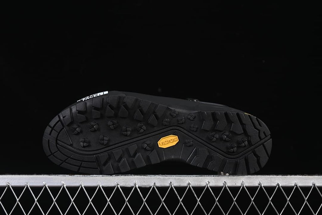 Underside view showing lugged tread and Vibram mark