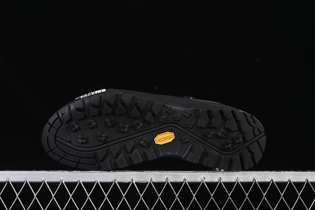 Underside view showing lugged tread and Vibram mark