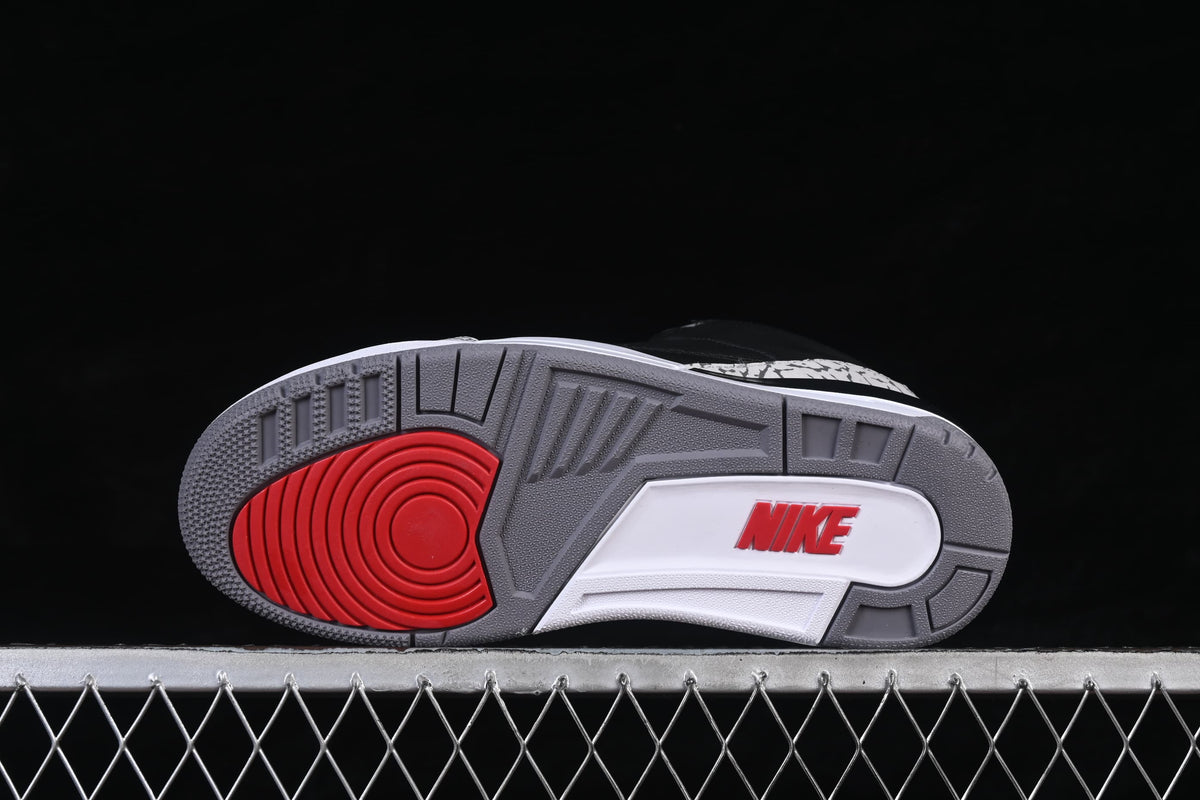 Outsole view showing grey tread and a red circular traction area