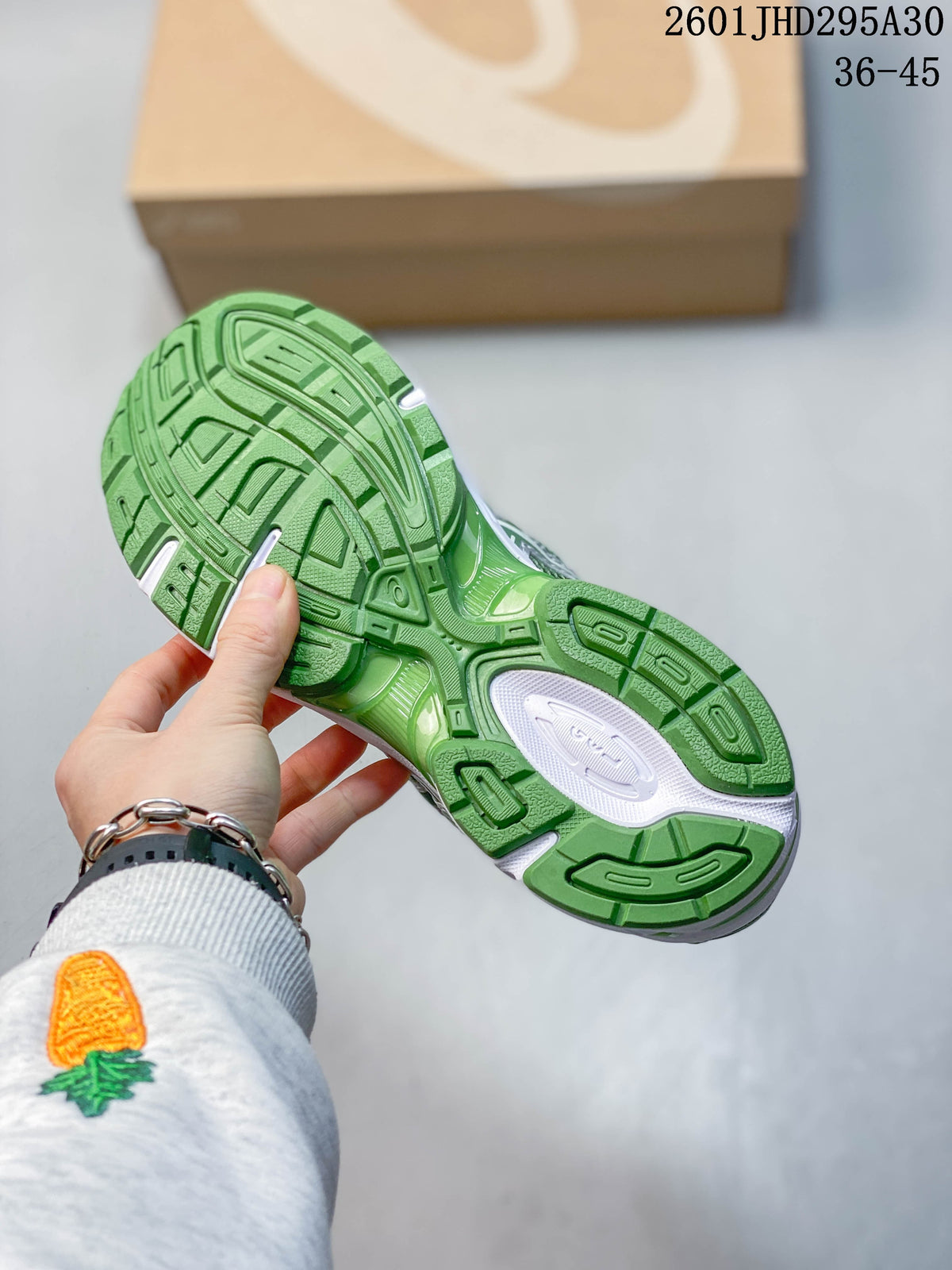 Green outsole of the ASICS GEL-NIMBUS 10.1 sneaker.