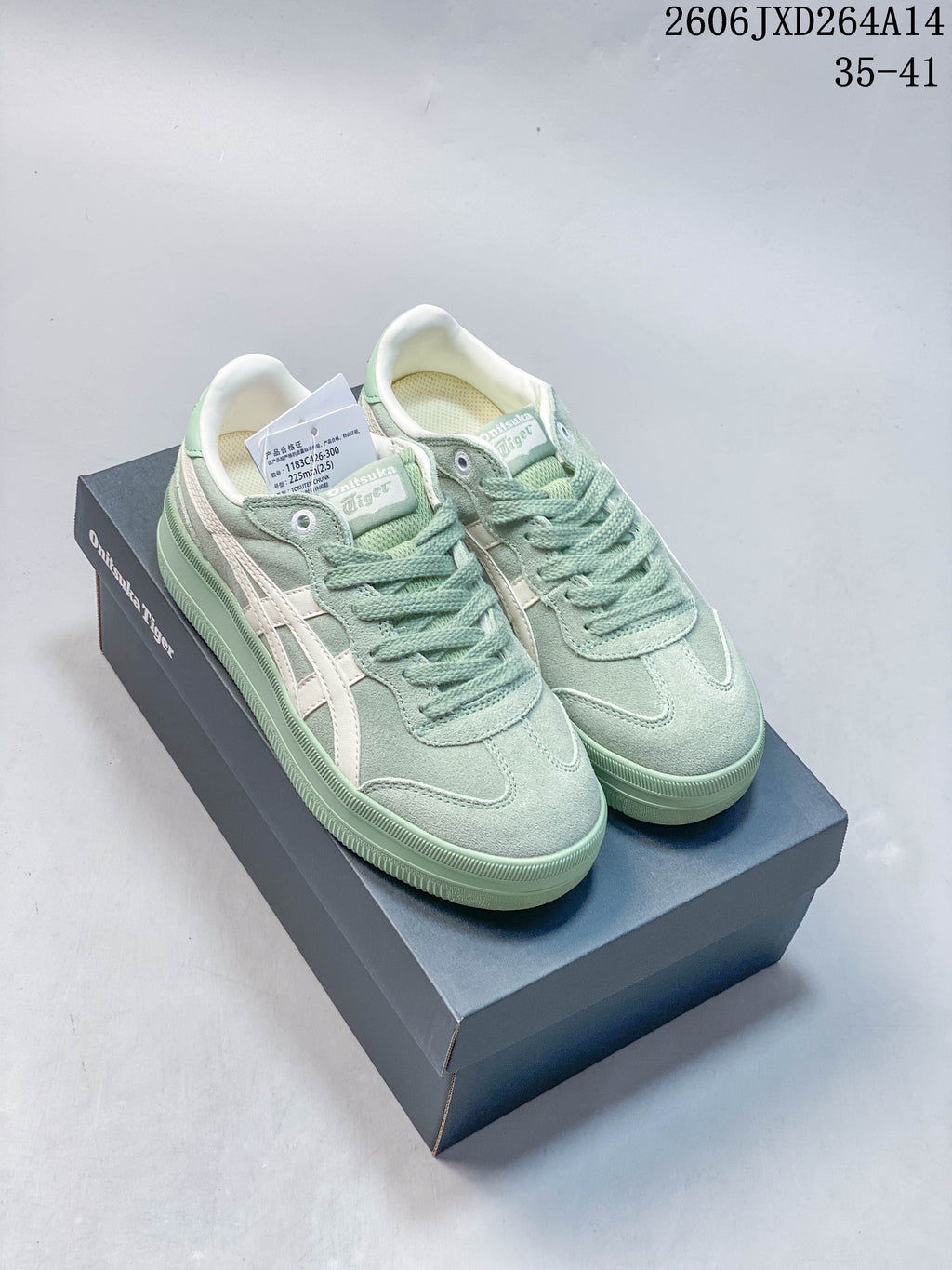 Pastel green Onitsuka Tiger Tokuten Chunk low-top sneakers on a shoebox
