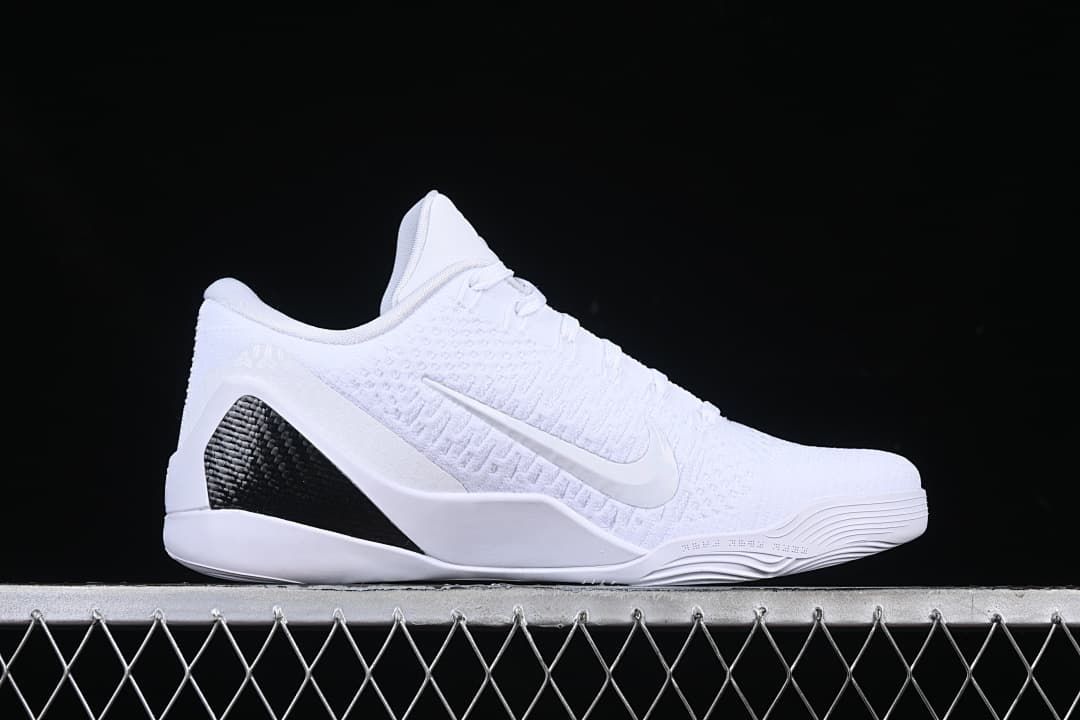 Side profile of the shoe highlighting its white upper and black heel accent