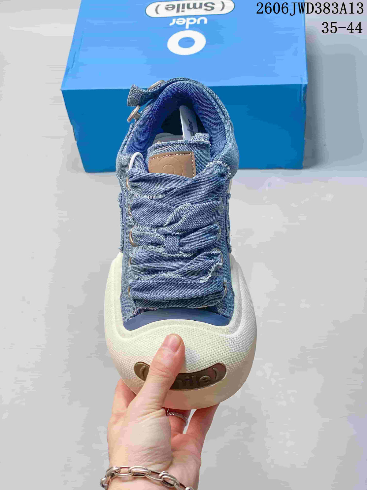 Front view highlighting the oversized laces and broad white toe bumper.