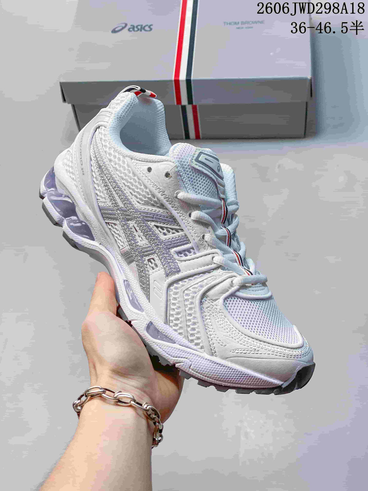 Angled side view of the white ASICS GT-2160 sneaker with silver-gray overlays