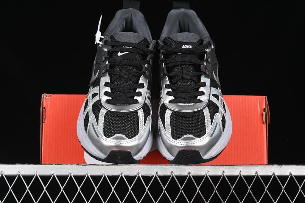 Front view of the pair showing the toe shape, laces, and metallic-look overlays