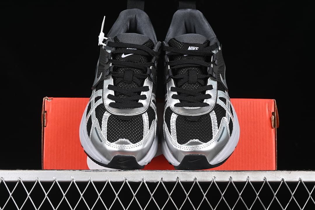 Front view of the pair showing the toe shape, laces, and metallic-look overlays