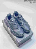 Pair of dark grey Adidas Barricade tennis shoes on a shoebox
