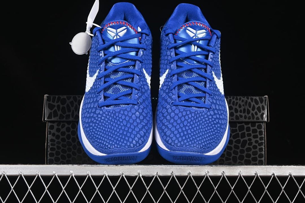 Front view of the pair showing blue patterned uppers and Kobe tongue logos