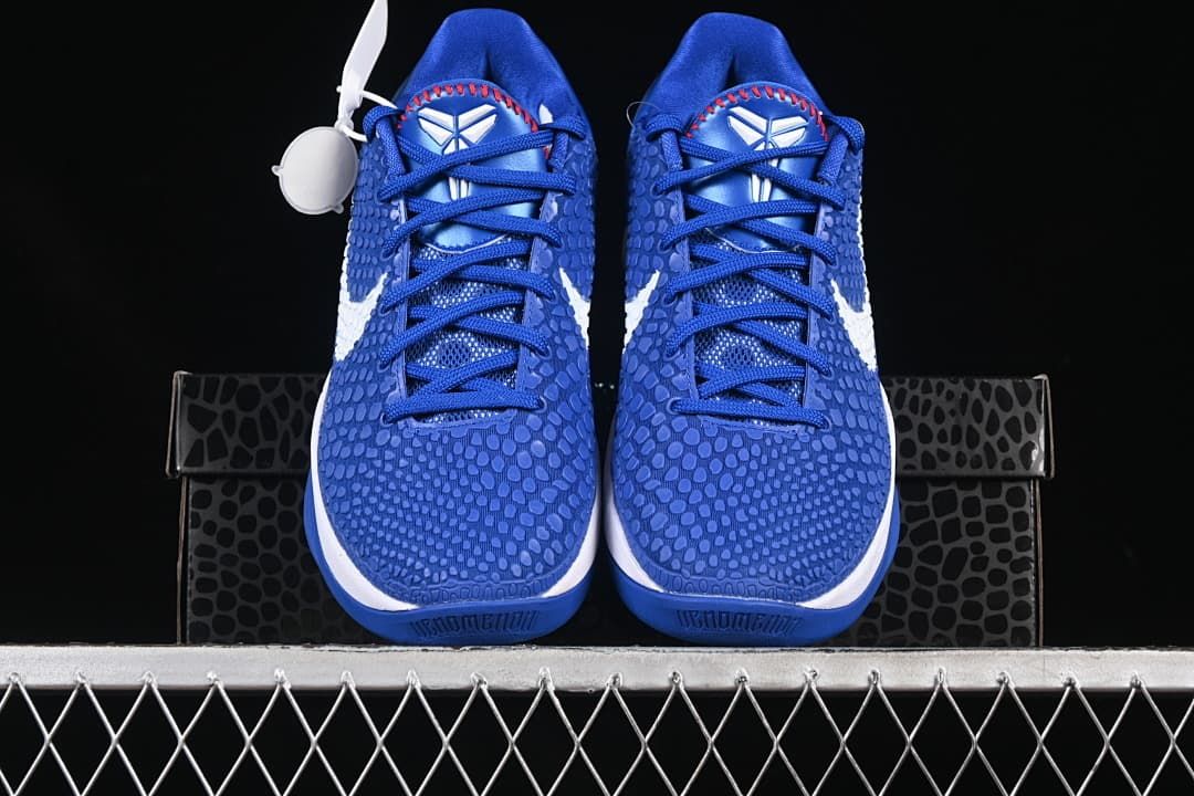 Front view of the pair showing blue patterned uppers and Kobe tongue logos