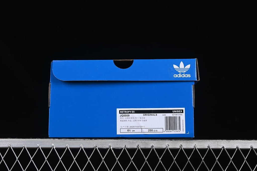 Blue adidas shoe box with a label identifying Retropy E5, JQ0009, and unisex
