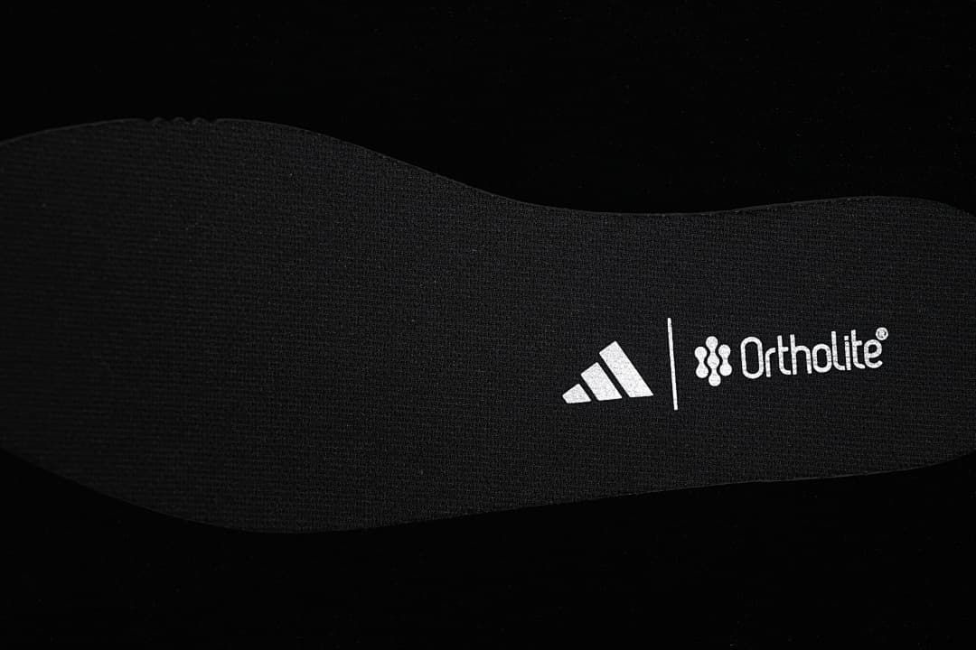 Close-up of the black insole with printed branding