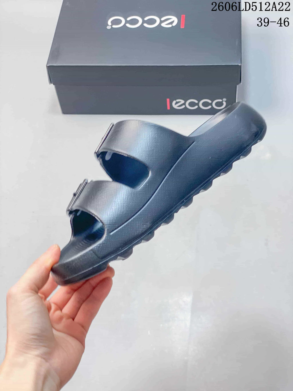 Side profile of a dark gray sandal showing its open toe and thick ridged sole; image displays style code 2606LD512A22 and sizes 39–46.