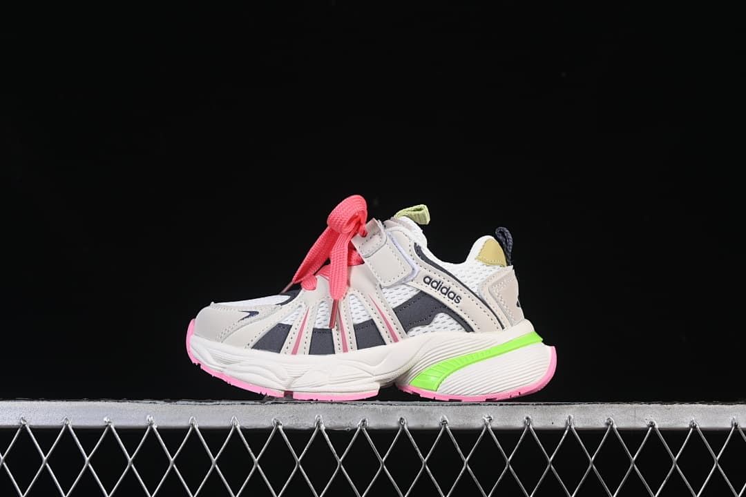 Side view of a kids’ Adidas Adistar sneaker in gray and white with pink laces and lime green heel detail.