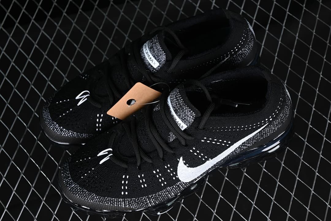 Pair of black and white Nike Air Vapormax 2023 Flyknit shoes viewed from above