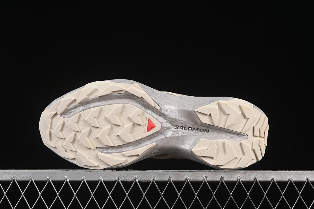 Underside view showing the lugged outsole and Salomon branding.