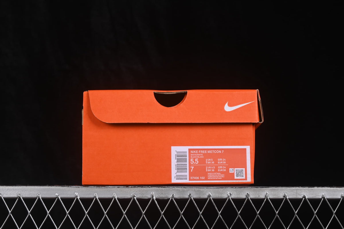 Orange Nike shoebox with a product label identifying Nike Free Metcon 7, color White/White, and style code II7406-102.
