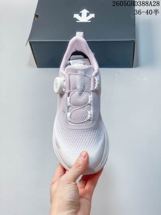 Front view of a pale purple and white Descente sneaker with lace-up toggle closure