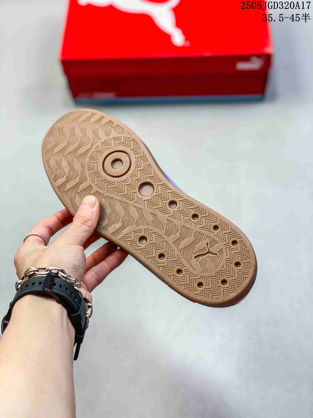 Close-up of the patterned gum-colored outsole on a pink PUMA sneaker