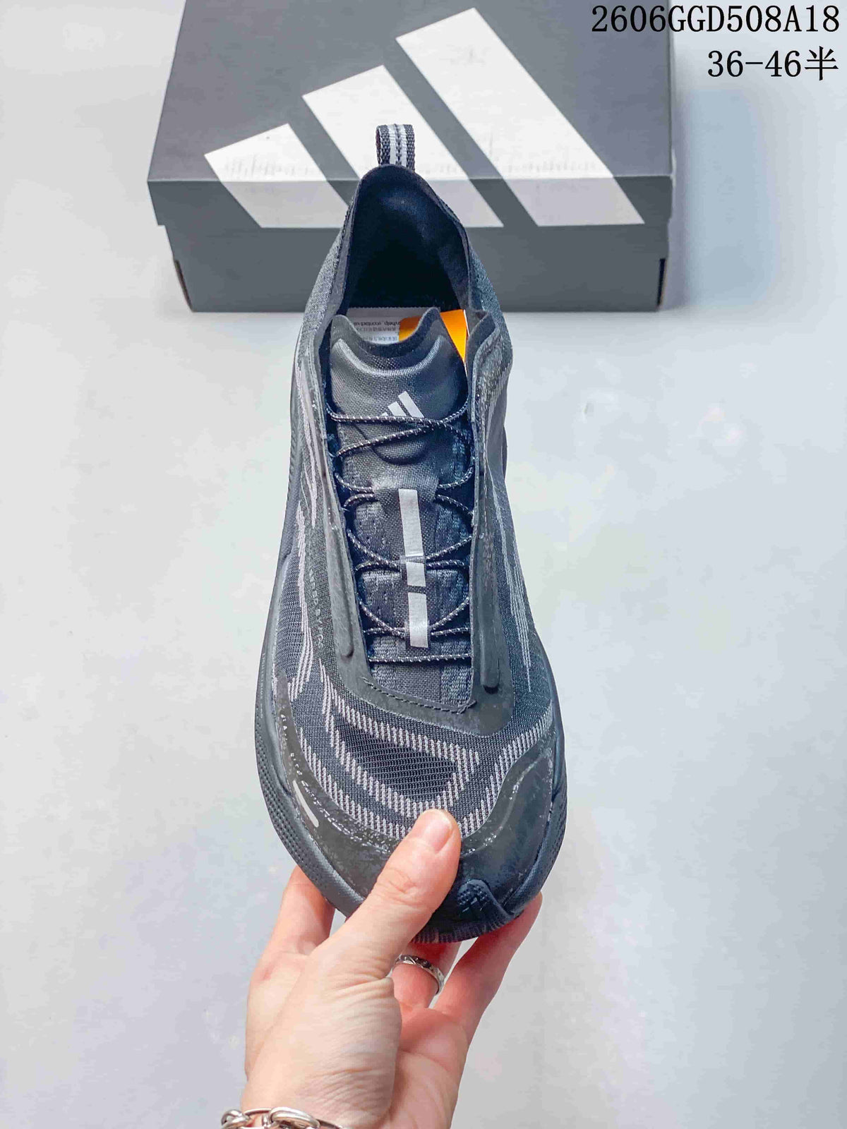 Top view of a gray lace-up trail running shoe