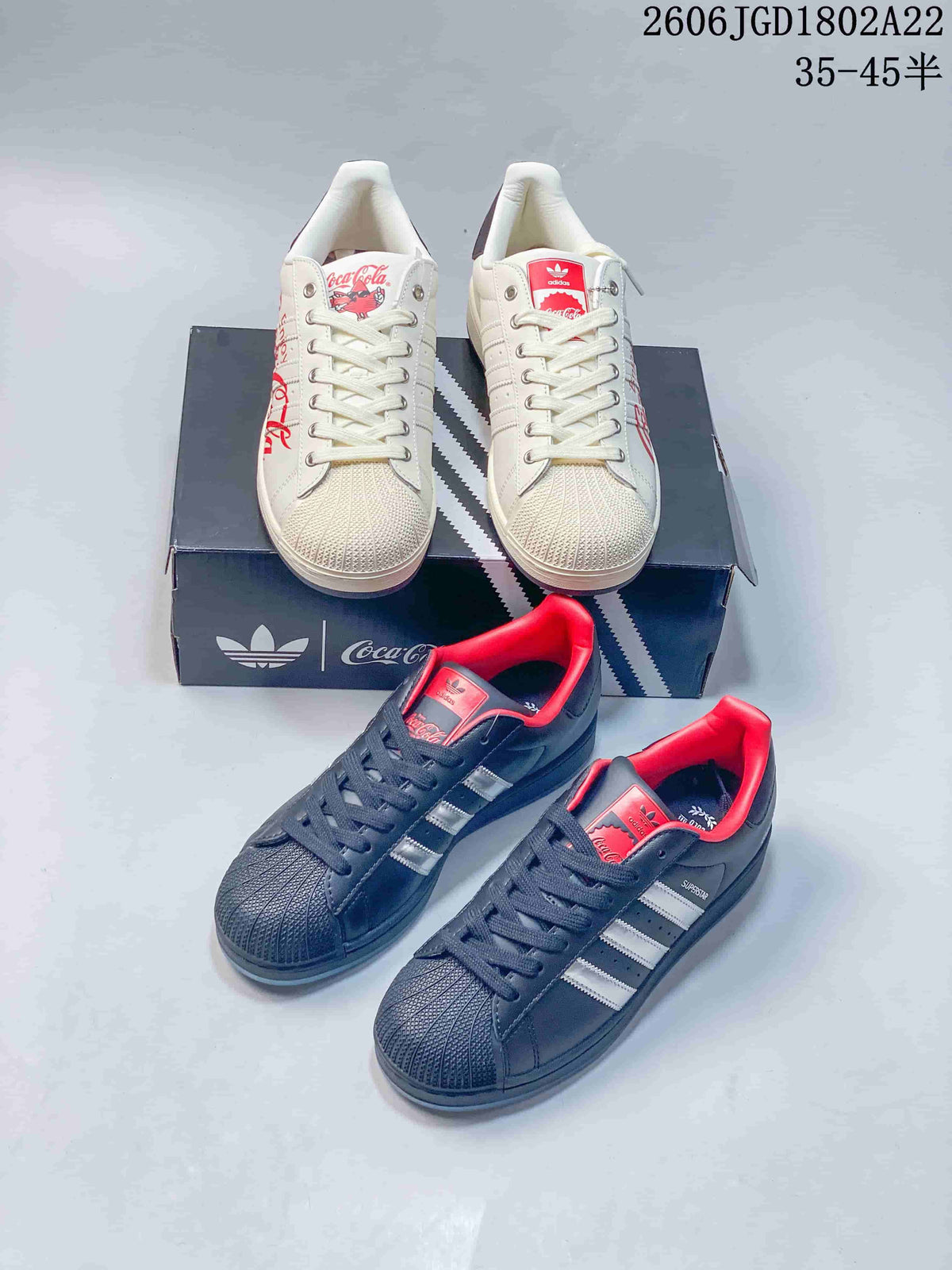 Off-white and dark navy low-top sneakers with Coca-Cola-themed details shown together.