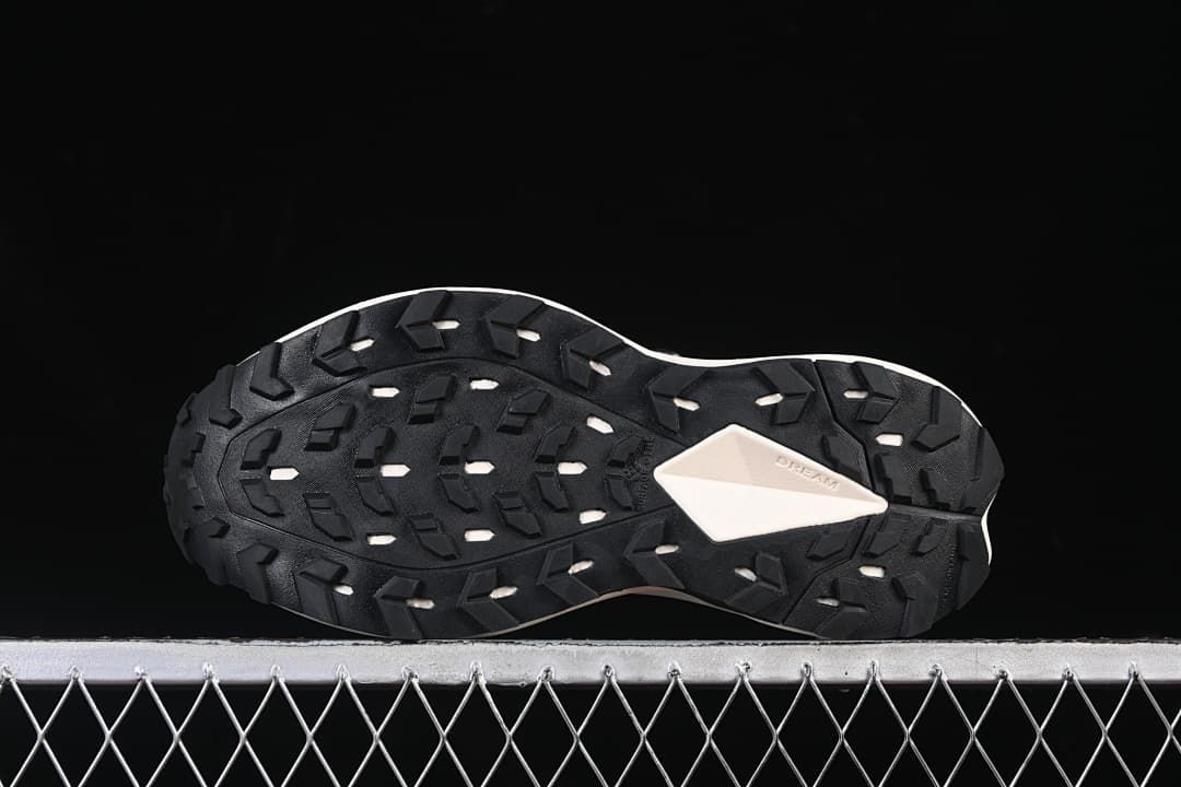 Underside view showing the lugged outsole pattern.