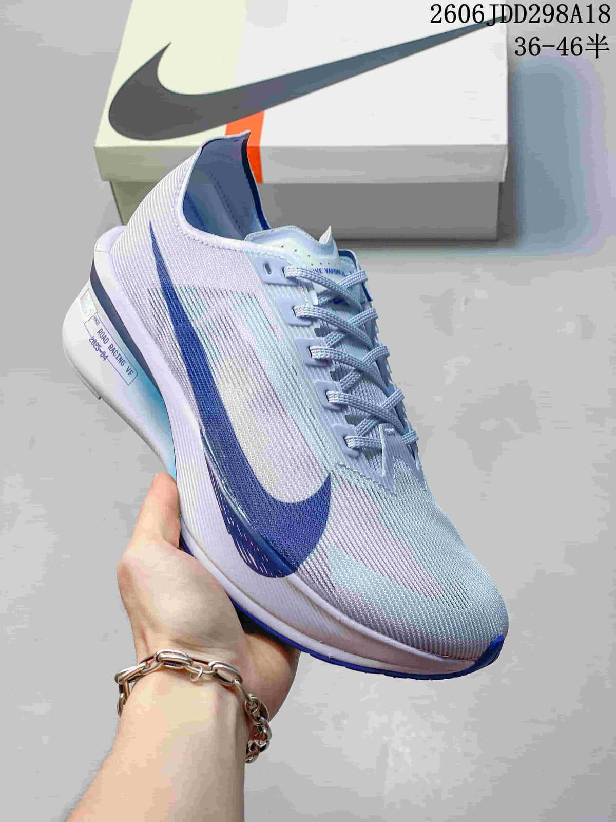 Close-up of a pale blue and lavender Nike ZoomX Vaporfly Next% 4 shoe.