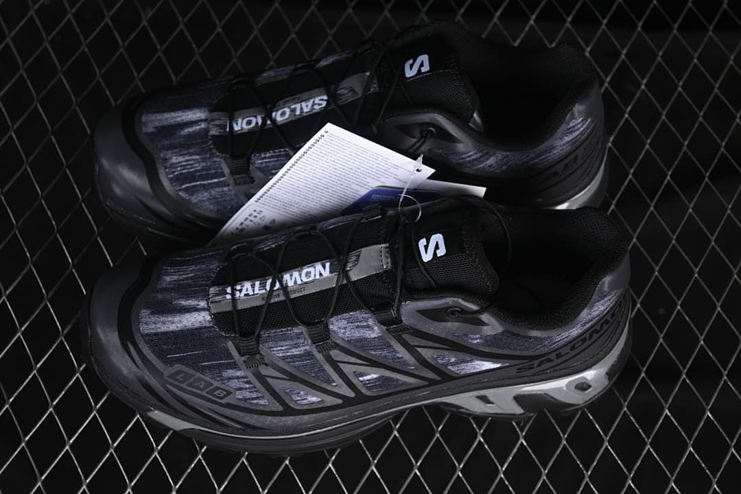Pair of black and gray Salomon XT-6 Camo sneakers