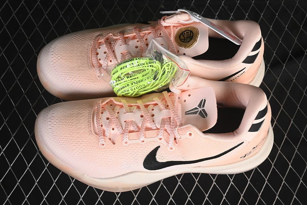 Pair of shoes with additional lime-colored laces