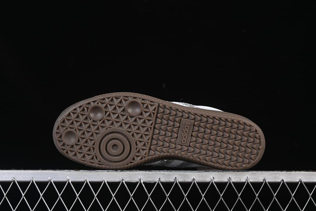 Underside of the gum-brown outsole with patterned tread.