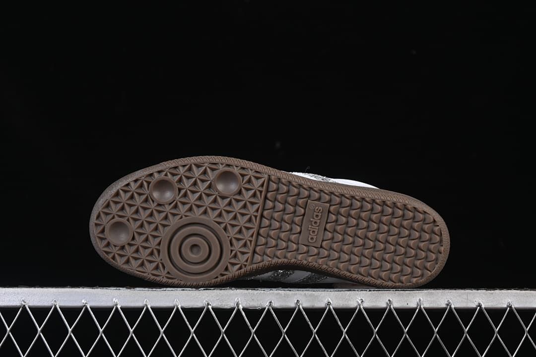 Underside of the gum-brown outsole with patterned tread.