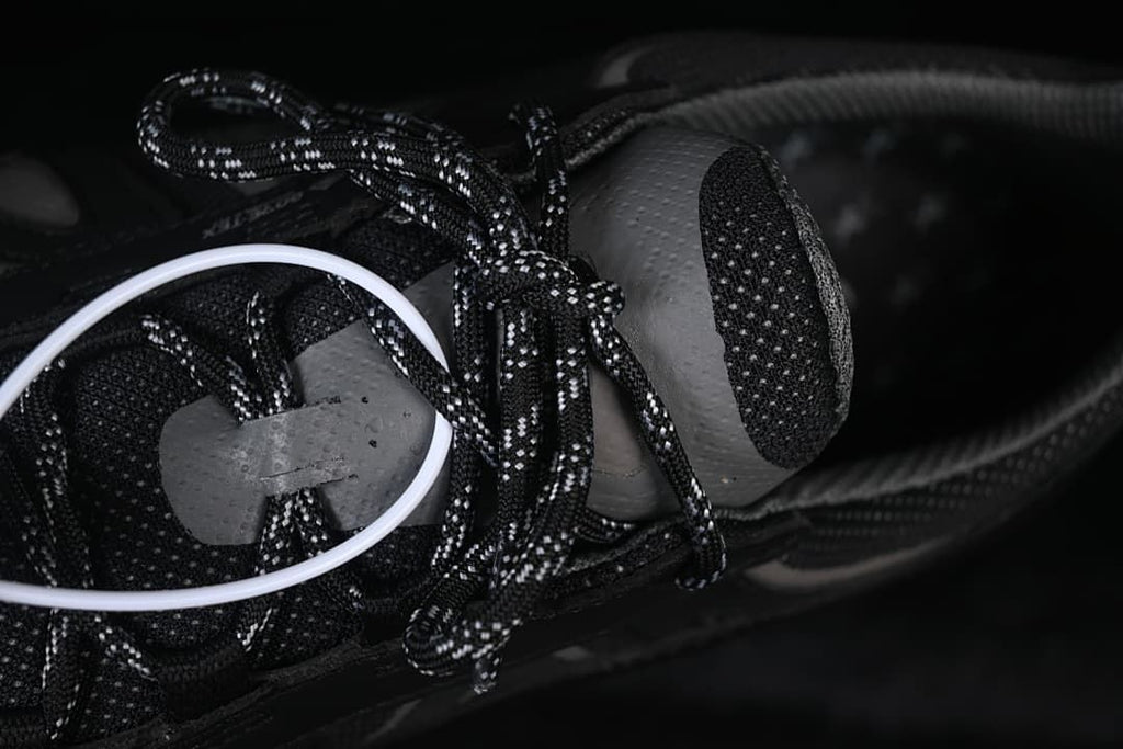Close-up of patterned laces and lace hardware