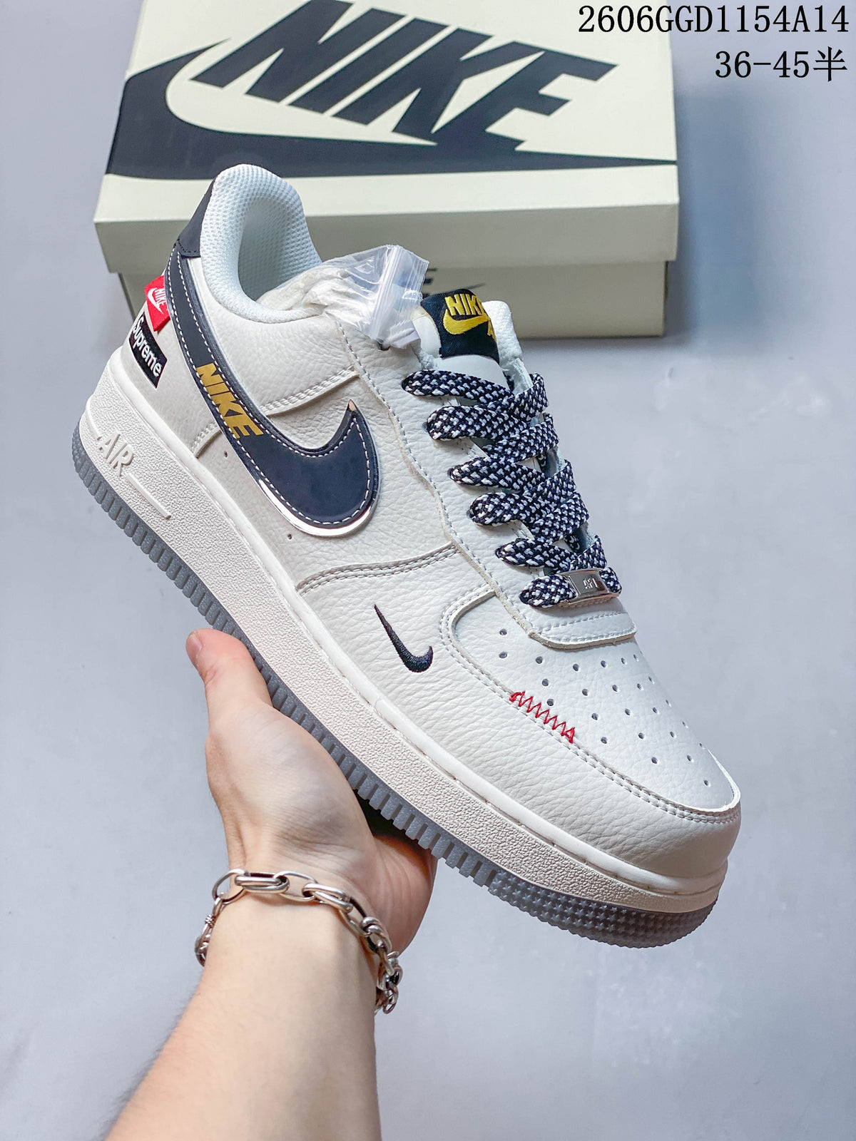 Close side view of an off-white sneaker with a dark swoosh, patterned laces and graphic heel details.