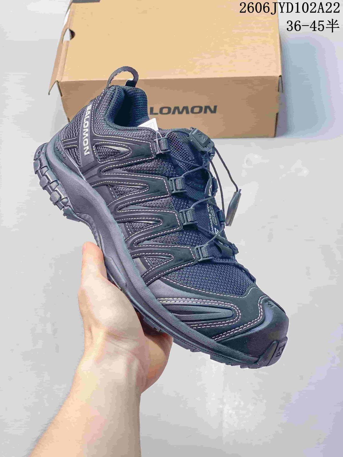 Dark navy Salomon XA Pro 3D sneaker with mesh panels and toggle lacing