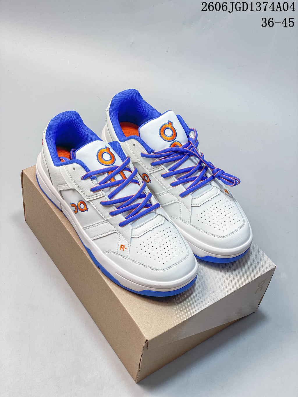 Pair of white On THE Roger Clubhouse sneakers with blue laces, blue collar lining and blue outsole accents