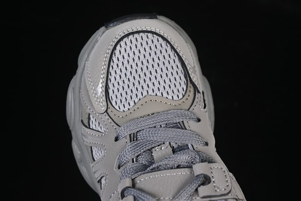 Top view of the perforated-look toe area and grey laces.