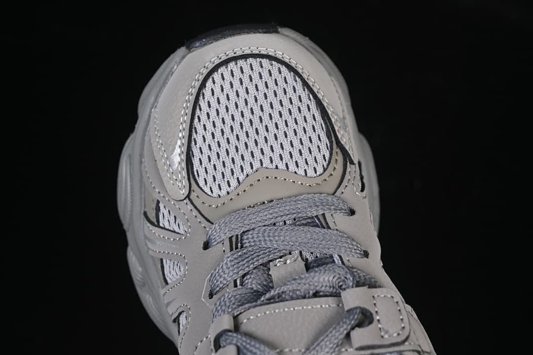 Top view of the perforated-look toe area and grey laces.