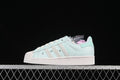 Side view of a mint green adidas Superstar II sneaker against a dark background