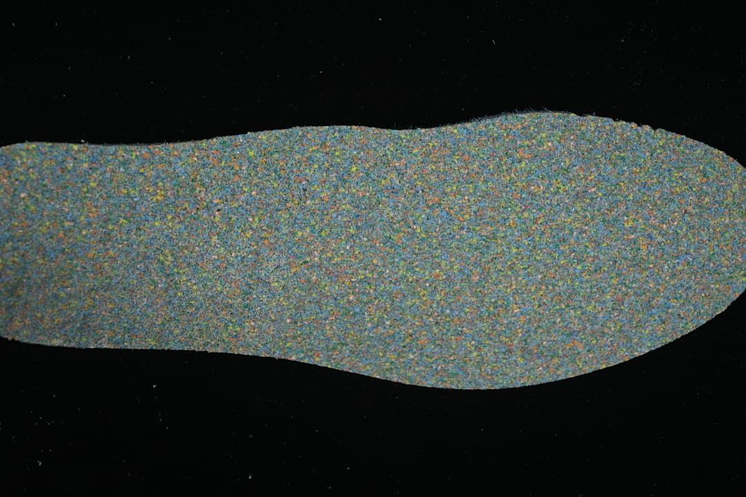 Close-up of a mottled multicolor shoe insole.