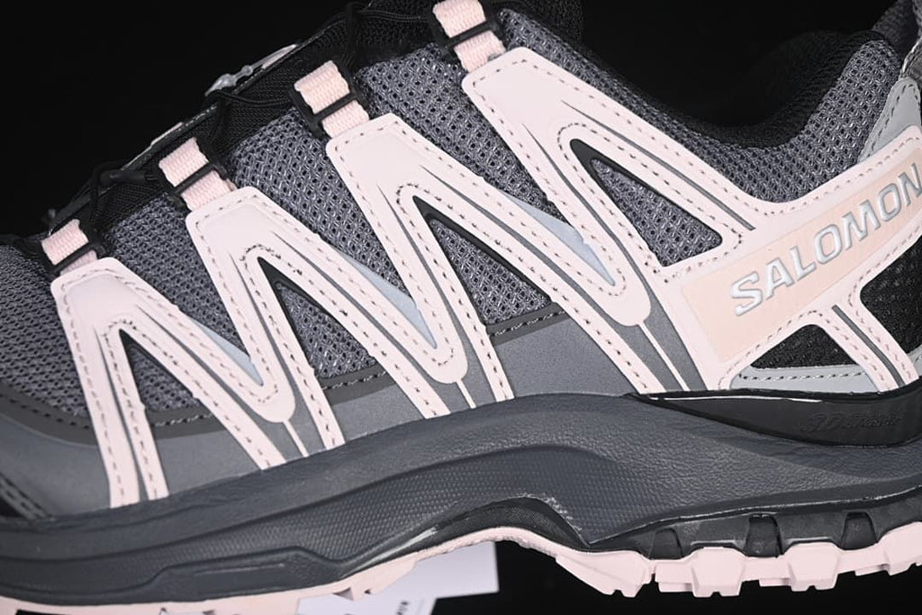 Close-up of the gray mesh upper and pale accent overlays