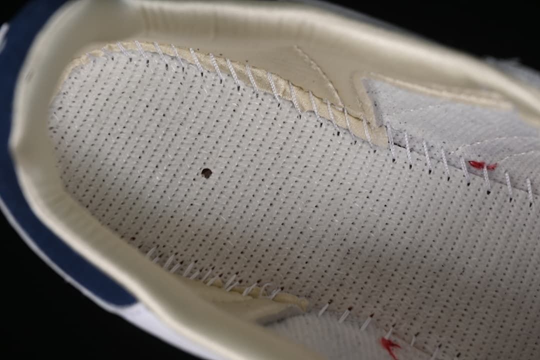 Close-up of the perforated interior lining and stitching