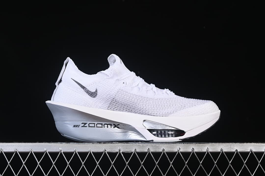 Side view of the shoe showing a small Swoosh and sculpted sole