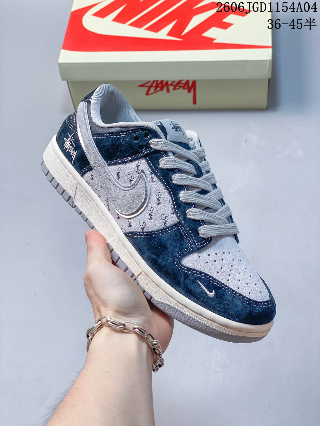 Angled side view of a blue and grey low-top sneaker