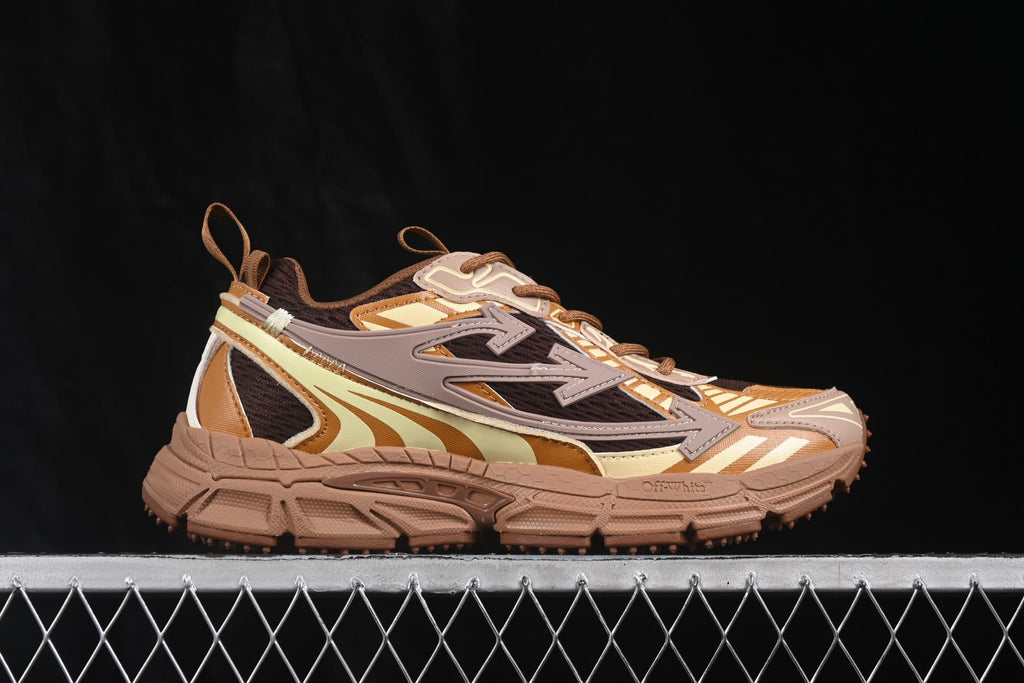 Opposite side profile showing the layered upper, large arrow-style side detail, pull tabs and brown sole.