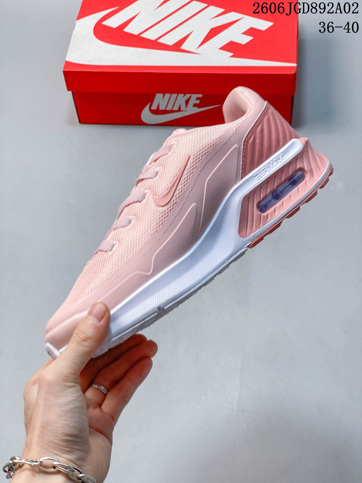 Side view of the pink shoe with a visible heel Air Max unit