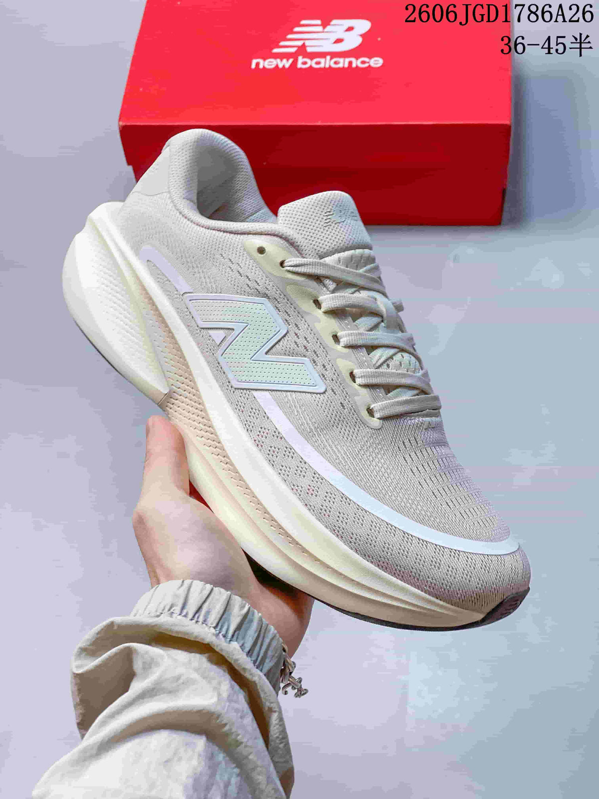 Side view of a light neutral New Balance Ellipse V1 low-top running shoe.